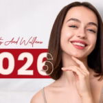 Smiling woman with straight brown hair poses against a split red and white background with "2026" and "Beauty and Wellness" text.
